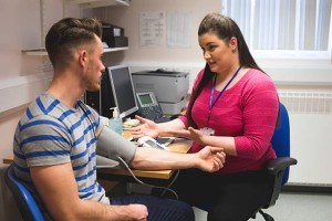 GP in office with patient